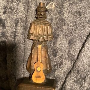 Carved musician